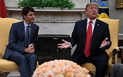 US President Donald Trump (R) speaks to the press during a meeting with Canadian Prime Minister Justin Trudeau at the White House on October 11, 2017. (AFP Photo/Jim Watson)