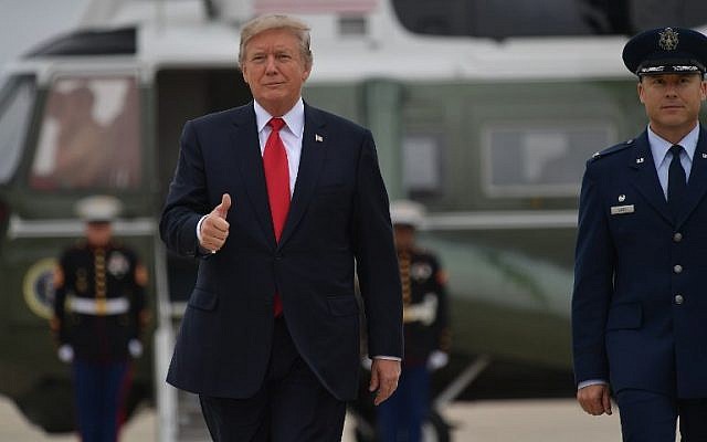 US President Donald Trump makes his way to board Air Force One before departing from Andrews Air Force Base in Maryland on October 11, 2017. (AFP Photo/Mandel Ngan) US President Donald Trump makes his way to board Air Force One before departing from Andrews Air Force Base in Maryland on October 11, 2017. (AFP Photo/Mandel Ngan)