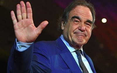 Oscar-winning US filmmaker Oliver Stone poses on the red carpet during the opening ceremony of the 22nd Busan International Film Festival (BIFF) at the Busan Cinema Center in Busan on October 12, 2017. (AFP PHOTO / JUNG Yeon-Je)