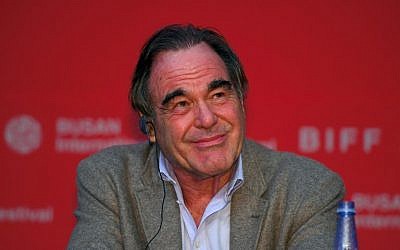 US director Oliver Stone smiles during a press conference of the New Currents Jury for the 22nd Busan International Film Festival (BIFF) at the Busan Cinema Center in Busan on October 13, 2017. (AFP PHOTO / JUNG Yeon-Je)