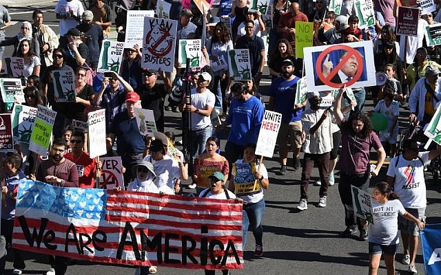 People march as they participate in the '#NoMuslimBanEver' rally in downtown Los Angeles, California on October 15, 2017. (AFP PHOTO / Mark RALSTON) People march as they participate in the '#NoMuslimBanEver' rally in downtown Los Angeles, California on October 15, 2017. (AFP PHOTO / Mark RALSTON)