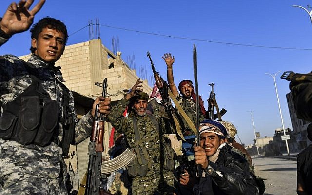 Members of the Syrian Democratic Forces, backed by US special forces, celebrate at the frontline in the Islamic State group jihadists crumbling stronghold of Raqqa, October 16, 2017. (AFP/BULENT KILIC) Members of the Syrian Democratic Forces, backed by US special forces, celebrate at the frontline in the Islamic State group jihadists crumbling stronghold of Raqqa, October 16, 2017. (AFP/BULENT KILIC)