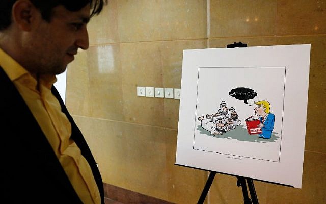 An Iranian man looks at an illustration during the 'Persian Gulf Forever' cartoon exhibition in Tehran on October 18, 2017. (AFP/STR) An Iranian man looks at an illustration during the 'Persian Gulf Forever' cartoon exhibition in Tehran on October 18, 2017. (AFP/STR)