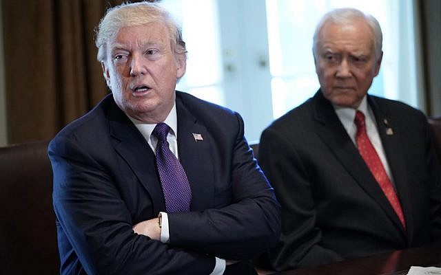 US President Donald Trump, left, speaks next to Senate Finance Committee Chairman Orin Hatch, on October 18, 2017. (AFP/MANDEL NGAN) US President Donald Trump, left, speaks next to Senate Finance Committee Chairman Orin Hatch, on October 18, 2017. (AFP/MANDEL NGAN)
