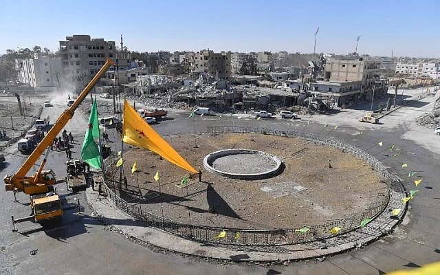 Preparations for liberation celebrations in the iconic Al-Naim square in Raqqa, October 18, 2017. (AFP/BULENT KILIC) Preparations for liberation celebrations in the iconic Al-Naim square in Raqqa, October 18, 2017. (AFP/BULENT KILIC)