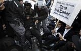 Police disperse ultra-Orthodox Jews demonstrating  in Jerusalem against the conscription of members of their community to the IDF, on October 19, 2017. (AFP Photo/ Menahem Kahana)