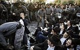 Police disperse ultra-Orthodox Jews demonstrating  in Jerusalem against the conscription of members of their community to the IDF on October 19, 2017. (AFP Photo/Menahem Kahana)