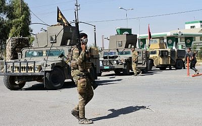 A fighter loyal to the Iraqi federal government is seen in the region of Altun Kupri, about 50 kilometers (30 miles) from Irbil, the capital of autonomous Iraqi Kurdistan, on October 20, 2017. (AFP Photo/Marwan Ibrahim)