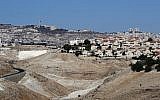 A picture taken from the Israeli settlement of Kedar shows the West Bank Israeli settlement of Maale Adumim (foreground-R), a few kilometers from East Jerusalem (background) on October 26, 2017. (AFP PHOTO / THOMAS COEX)