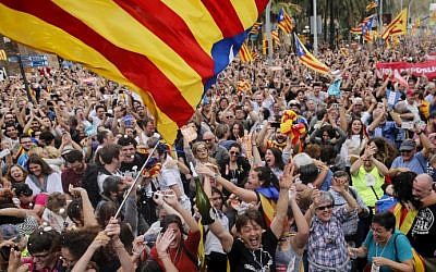 People celebrate after Catalonia's parliament voted to declare independence from Spain in Barcelona on October 27, 2017. (Pau Barrena/AFP)