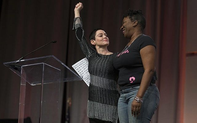 Illustrative: US actress Rose McGowan and Founder of #MeToo Campaign Tarana Burke, embrace on stage at the Women's March / Women's Convention in Detroit, Michigan, on October 27, 2017. (Rena Laverty/AFP) Illustrative: US actress Rose McGowan and Founder of #MeToo Campaign Tarana Burke, embrace on stage at the Women's March / Women's Convention in Detroit, Michigan, on October 27, 2017. (Rena Laverty/AFP)