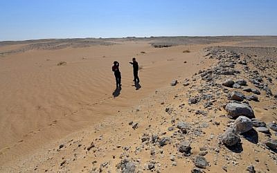 Members of the Austrian Space Forum inspect a site in Oman's Dhofar desert, near the southern Marmul outpost, on October 29, 2017, in preparation for a four-week Mars simulation mission due to begin next year. (AFP Photo/Giuseppe Cacace)
