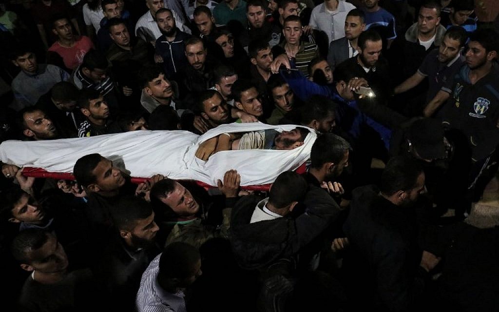 The body of Marwan Alagha, 22, is carried by mourners after he was killed when Israel blew up a tunnel built by the Islamic Jihad terror group stretching from the Gaza Strip into its territory, at Naser hospital in Khan Yunis, in the southern Gaza Strip, on October 30, 2017. (SAID KHATIB / AFP) The body of Marwan Alagha, 22, is carried by mourners after he was killed when Israel blew up a tunnel built by the Islamic Jihad terror group stretching from the Gaza Strip into its territory, at Naser hospital in Khan Yunis, in the southern Gaza Strip, on October 30, 2017. (SAID KHATIB / AFP)