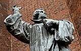A picture taken on October 28, 2016 shows a bronze statue of German theologian Martin Luther outside the Marktkirche (Market Church) in Hannover, Germany. (AFP PHOTO / dpa / Holger Hollemann)