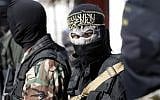 Illustrative: Members of the Palestinian Islamic Jihad terror group attend the funeral of fellow terrorists killed in an Israeli operation to blow up a tunnel stretching from the Gaza Strip into Israel in central Gaza, on October 31, 2017. (AFP/Thomas Coex)