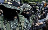 Terrorists from the Islamic Jihad Movement in Palestine attend the funeral of fellow members killed in an Israeli operation to blow up a tunnel stretching from the Gaza Strip into Israel during their funeral at the Bureij refugee camp, in central Gaza, on October 31, 2017.  (MAHMUD HAMS / AFP)