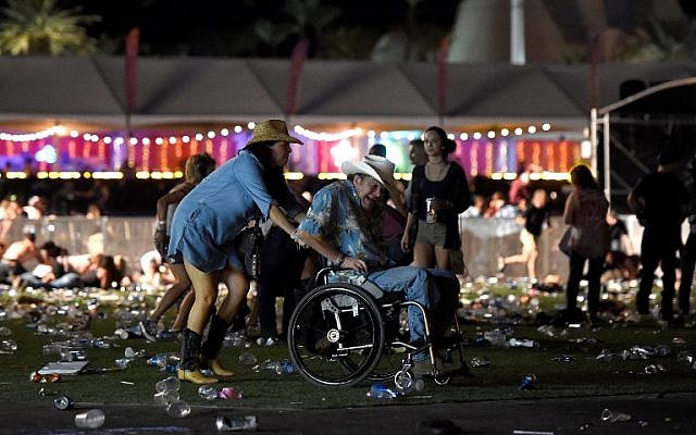 A man in a wheelchair is taken away from the Route 91 Harvest country music festival after apparent gun fire was heard on October 1, 2017 in Las Vegas, Nevada. (David Becker/Getty Images/AFP) A man in a wheelchair is taken away from the Route 91 Harvest country music festival after apparent gun fire was heard on October 1, 2017 in Las Vegas, Nevada. (David Becker/Getty Images/AFP)