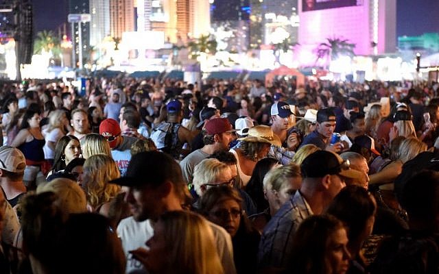 A crowd of people at the Route 91 Harvest country music festival after gunfire was heard on October 1, 2017, in Las Vegas, Nevada. (David Becker/Getty Images/AFP) A crowd of people at the Route 91 Harvest country music festival after gunfire was heard on October 1, 2017, in Las Vegas, Nevada. (David Becker/Getty Images/AFP)