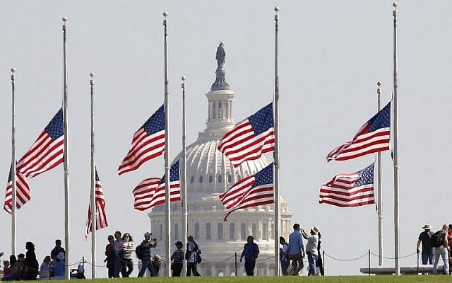 American flags on the grounds of the Washington Monument are flown at half-mast on October 2, 2017, after US President Donald Trump ordered the flags on all federal buildings to fly at half-mast following the mass shooting that left more than 50 dead in Las Vegas. (Mark Wilson/Getty Images/AFP) American flags on the grounds of the Washington Monument are flown at half-mast on October 2, 2017, after US President Donald Trump ordered the flags on all federal buildings to fly at half-mast following the mass shooting that left more than 50 dead in Las Vegas. (Mark Wilson/Getty Images/AFP)