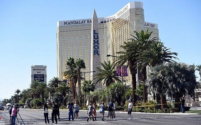 People cross the Las Vegas Strip after a lone gunman opened fired on the Route 91 Harvest country music festival on October 2, 2017 in Las Vegas, Nevada. (David Becker/Getty Images/AFP) People cross the Las Vegas Strip after a lone gunman opened fired on the Route 91 Harvest country music festival on October 2, 2017 in Las Vegas, Nevada. (David Becker/Getty Images/AFP)
