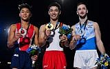 Israeli gymnast Artem Dolgopyat (R) next to Kenzo Shirai of Japan (C) and Yul Moldauer of the United States after taking top positions on the floor exercise during the individual apparatus finals of the Artistic Gymnastics World Championships in Montreal, Canada, October 7, 2017. (Minas Panagiotakis/Getty Images/AFP)