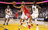 Ryan Anderson #33 of the Houston Rockets and Draymond Green #23 of the Golden State Warriors go for the ball during their NBA game at ORACLE Arena on October 17, 2017, in Oakland, California.  (Ezra Shaw/Getty Images/AFP)