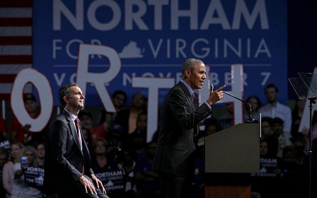 Former US President Barack Obama, right, speaks as he campaigns for Democratic gubernatorial candidate and Virginia Lieutenant Governor Ralph Northam during a campaign event at the Greater Richmond Convention Center October 19, 2017 in Richmond, Virginia. (Alex Wong/Getty Images/AFP)