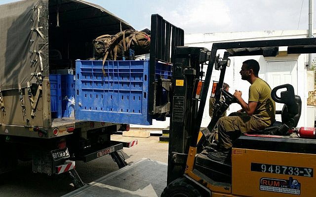 Illustrative. A forklift operator loads equipment onto a truck on an IDF base. (Israel Defense Forces/Flickr) Illustrative. A forklift operator loads equipment onto a truck on an IDF base. (Israel Defense Forces/Flickr)