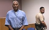 Former NFL football star OJ Simpson enters for his parole hearing at the Lovelock Correctional Center in Lovelock, Nevada,  July 20, 2017. (Jason Bean/The Reno Gazette-Journal via AP)
