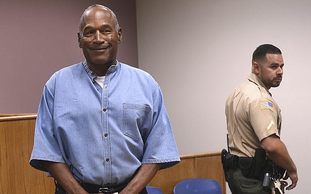Former NFL football star OJ Simpson enters for his parole hearing at the Lovelock Correctional Center in Lovelock, Nevada, July 20, 2017. (Jason Bean/The Reno Gazette-Journal via AP) Former NFL football star OJ Simpson enters for his parole hearing at the Lovelock Correctional Center in Lovelock, Nevada, July 20, 2017. (Jason Bean/The Reno Gazette-Journal via AP)