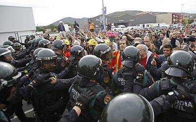People block the street in a stand off with civil guards in Sant Julia de Ramis, near Girona, Spain, October 1, 2017. (AP Photo/Francisco Seco)