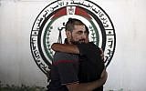 A Palestinian Fatah member receives greetings, after being released from a Hamas jail in front of the interior ministry, in Gaza City, October 1, 2017. (AP Photo/Khalil Hamra)