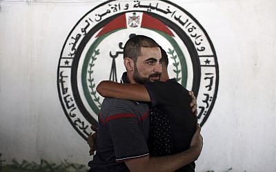 A Palestinian Fatah member receives greetings, after being released from a Hamas jail in front of the interior ministry, in Gaza City, October 1, 2017. (AP Photo/Khalil Hamra)