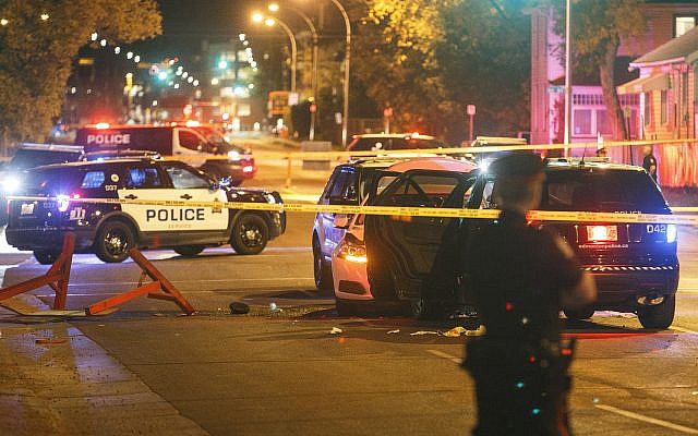 Police investigate the scene where a car crashed into a roadblock in Edmonton Alta, September 30, 2017. (Jason Franson/The Canadian Press via AP) Police investigate the scene where a car crashed into a roadblock in Edmonton Alta, September 30, 2017. (Jason Franson/The Canadian Press via AP)