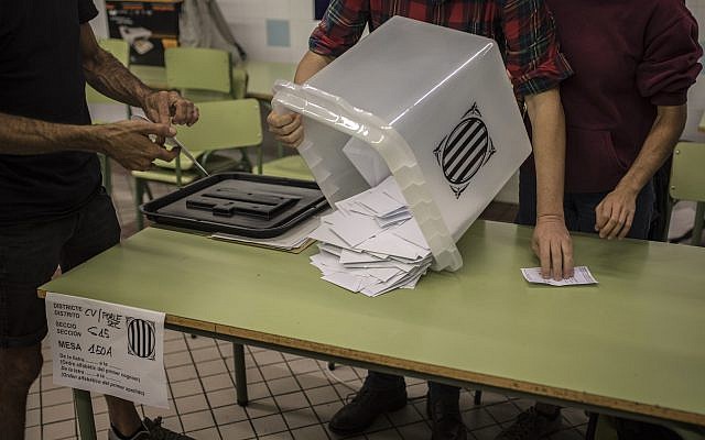 Officials empty a ballot box to count the votes at a school listed to be a polling station by the Catalan government in Barcelona, Spain, October 1, 2017. (AP Photo/Santi Palacios) Officials empty a ballot box to count the votes at a school listed to be a polling station by the Catalan government in Barcelona, Spain, October 1, 2017. (AP Photo/Santi Palacios)