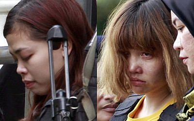 Indonesian suspect Siti Aisyah, left, and Vietnamese suspect Doan Thi Huong, both suspects in the killing of Kim Jong Nam, North Korean leader Kim Jong Un's estranged half brother, are escorted out of court by police officers in Sepang, Malaysia, March 1 2017. (AP Photo/Daniel Chan, File)