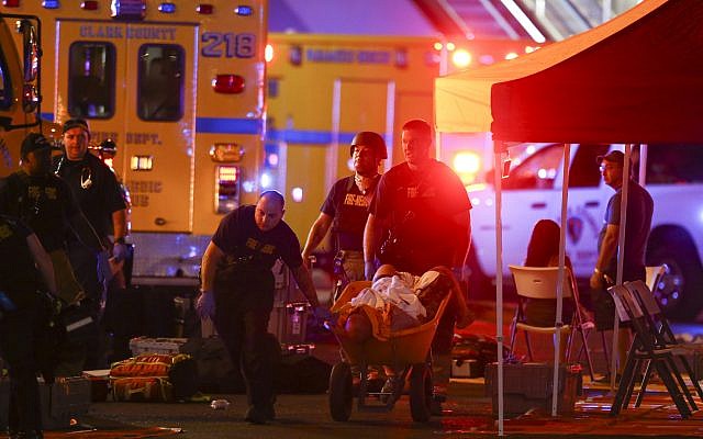 A wounded person is walked in on a wheelbarrow as Las Vegas police respond during an active shooter situation on the Las Vegas Strip in Las Vegas, October 1, 2017. (Chase Stevens/Las Vegas Review-Journal via AP) A wounded person is walked in on a wheelbarrow as Las Vegas police respond during an active shooter situation on the Las Vegas Strip in Las Vegas, October 1, 2017. (Chase Stevens/Las Vegas Review-Journal via AP)