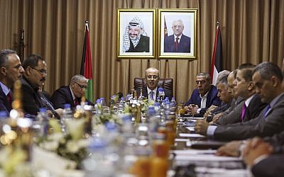 Palestinian Prime Minister Rami Hamdallah, center, chairs a reconciliation government cabinet meeting in Gaza City, October 3, 2017. (Mohammed Abed/Pool Photo via AP)