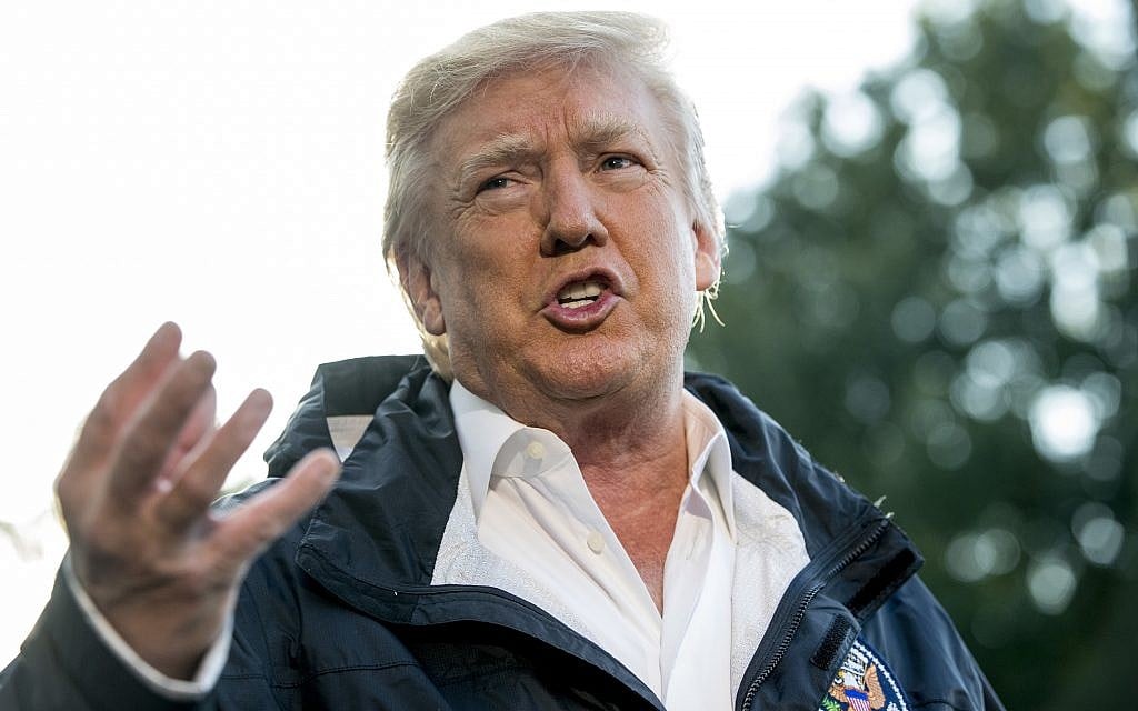 US President Donald Trump talks to reporters as he walks to board Marine One on the South Lawn of the White House in Washington, Tuesday, Oct. 3, 2017, for a short trip to Andrews Air Force Base, Md. and then on to Puerto Rico (AP Photo/Andrew Harnik)
