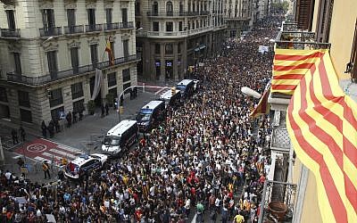 Protesters gather outside National Police Headquarters during a one-day strike in Barcelona, Spain, October 3, 2017. (AP/Bob Edme)