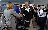 US President Donald Trump shakes hands with San Juan Mayor Carmen Yulin Cruz during a briefing on hurricane recovery efforts with first responders at Luis Muniz Air National Guard Base, Tuesday, October 3, 2017, in San Juan, Puerto Rico. (AP Photo/Evan Vucci)