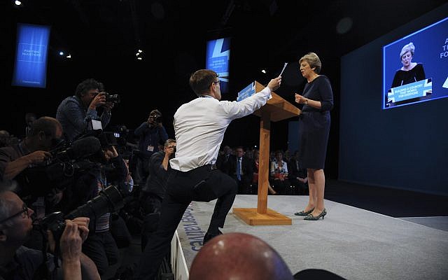 Comedian Simon Brodkin, also known as Lee Nelson, interrupts the Conservative Party Leader and Prime Minister, Theresa May, during her speech at the Conservative Party Conference at Manchester Central, in Manchester, England, Wednesday, Oct. 4, 2017. (AP Photo/Rui Vieira) Comedian Simon Brodkin, also known as Lee Nelson, interrupts the Conservative Party Leader and Prime Minister, Theresa May, during her speech at the Conservative Party Conference at Manchester Central, in Manchester, England, Wednesday, Oct. 4, 2017. (AP Photo/Rui Vieira)