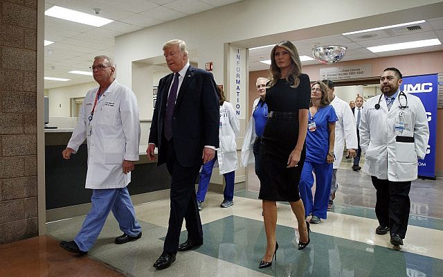 US President Donald Trump and First :ady Melania Trump walk with surgeon Dr. John Fildes, left, at the University Medical Center after meeting with survivors of the mass shooting Wednesday, October 4, 2017, in Las Vegas. (AP Photo/Evan Vucci) US President Donald Trump and First :ady Melania Trump walk with surgeon Dr. John Fildes, left, at the University Medical Center after meeting with survivors of the mass shooting Wednesday, October 4, 2017, in Las Vegas. (AP Photo/Evan Vucci)