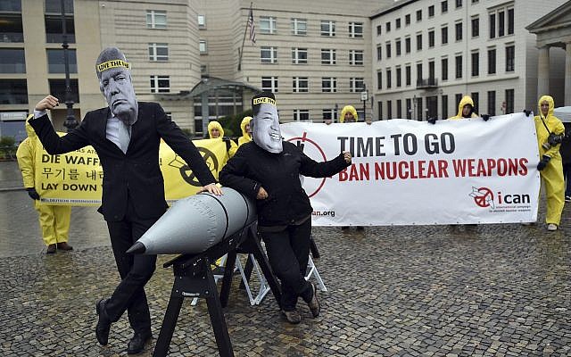 In this file photo from September 13, 2017, activists from the International Campaign to Abolish Nuclear Weapons (ICAN) protest against the conflict between North Korea and the USA with masks of North Korean ruler Kim Jong Un, right, and US president Donald Trump, left, in front of the US embassy in Berlin, Germany. (Britta Pedersen/dpa via AP) In this file photo from September 13, 2017, activists from the International Campaign to Abolish Nuclear Weapons (ICAN) protest against the conflict between North Korea and the USA with masks of North Korean ruler Kim Jong Un, right, and US president Donald Trump, left, in front of the US embassy in Berlin, Germany. (Britta Pedersen/dpa via AP)
