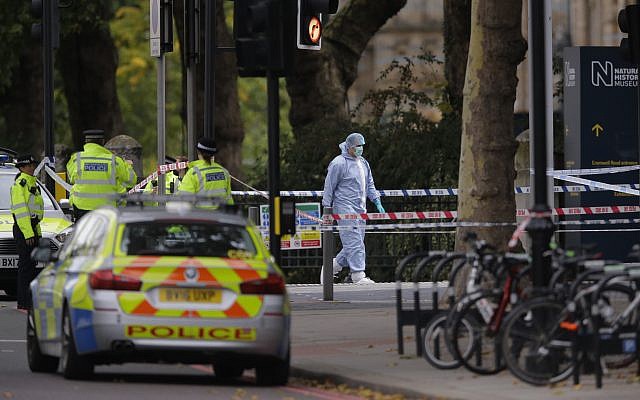 Britain's Police and a forensic investigator at the scene of an incident in central London, Saturday, Oct. 7, 2017. London police say emergency services are outside the Natural History Museum in London after a car struck pedestrians. (AP/Alastair Grant) Britain's Police and a forensic investigator at the scene of an incident in central London, Saturday, Oct. 7, 2017. London police say emergency services are outside the Natural History Museum in London after a car struck pedestrians. (AP/Alastair Grant)