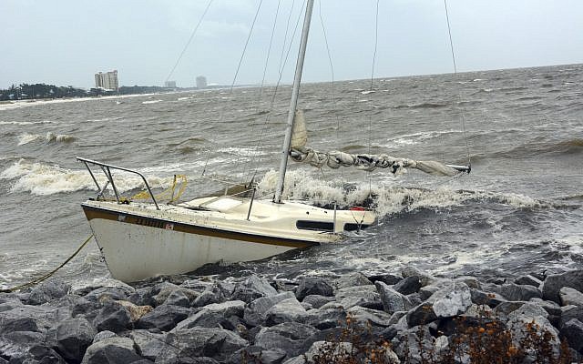 An abandoned boat takes on water on the Mississippi Gulf Coast, Saturday, October 7, 2017, near Biloxi, Miss., as the outer bands of Hurricane Nate begin to batter the shore. (Justin Vicory/The Clarion-Ledger via AP) An abandoned boat takes on water on the Mississippi Gulf Coast, Saturday, October 7, 2017, near Biloxi, Miss., as the outer bands of Hurricane Nate begin to batter the shore. (Justin Vicory/The Clarion-Ledger via AP)