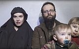 In this image from video released by Taliban Media in December 2016, Caitlan Coleman talks in the video while her Canadian husband Joshua Boyle holds their two children.   (Taliban Media via AP)