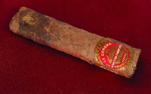 This auction item is a cigar once smoked by then-British prime minister Winston Churchill. Churchill's half-smoked cigar, from a 1947 trip to Paris, sold for just over $12,000 during an online auction. (RR Auction photo via AP)