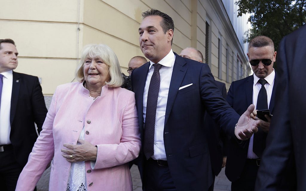 Hans-Christian Strache, leader of the far right Austrian Freedom Party, and his mother Marion Strache, left, leave after casting their votes in Vienna, Austria, October 15, 2017. (AP Photo/Matthias Schrader)