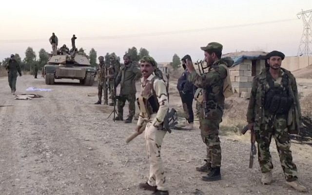 This image from a video shows Iraqi soldiers in the Qatash area near a gas plant, south of Kirkuk, Iraq, October 16, 2017. (APTN via AP) This image from a video shows Iraqi soldiers in the Qatash area near a gas plant, south of Kirkuk, Iraq, October 16, 2017. (APTN via AP)